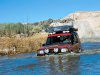 03084w_14z+Land_Rover_NAS_110_Defender+Front_Driver_Side_View_Cars_Over_River.jpg