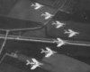 Military_aircraft_flying_in_a_V_formation_1.jpg