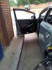 Lowered Prius - open door at gas pump curb.jpg
