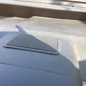 Rubber sealant underneath the edge of the centre speaker